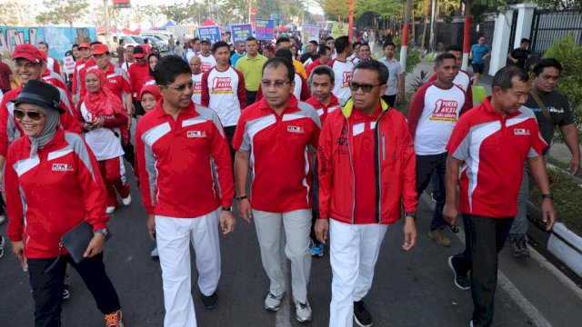 Jalan santai dan kampanye anti korupsi dalam rangka Anti-Corruption Summit (ACS) 2018 di Anjungan Pantai Losari, Minggu (21/10/2018).